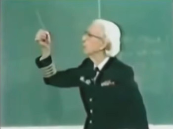 Still of Hopper holding the short wire up in the air.